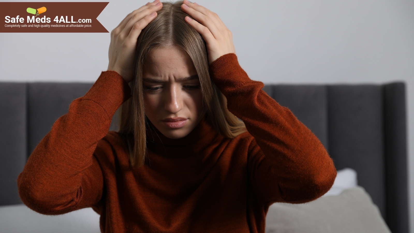 A girl holding her head in distress.