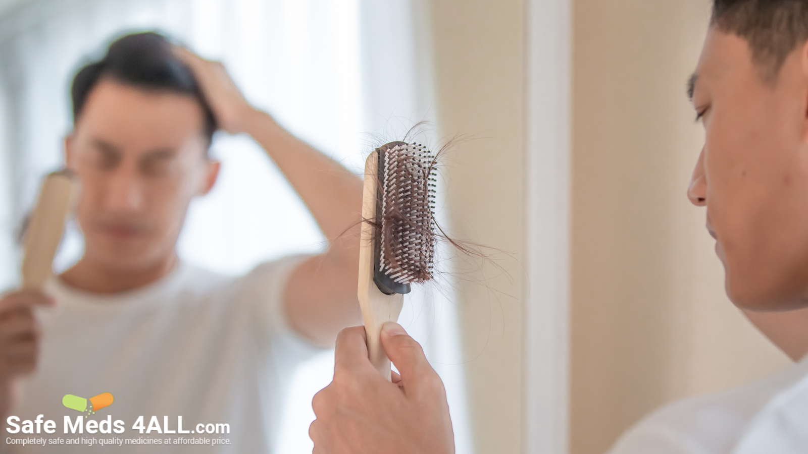 A man looking at his hairbrush