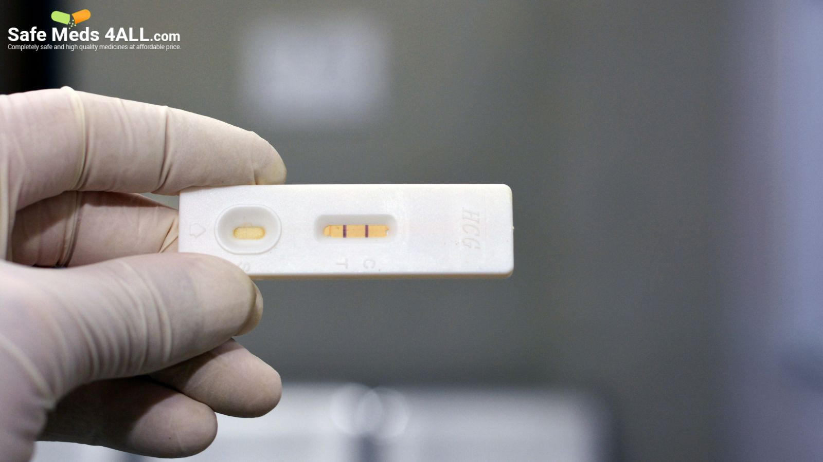 Checking pregnancy results on a pregnancy test kit.