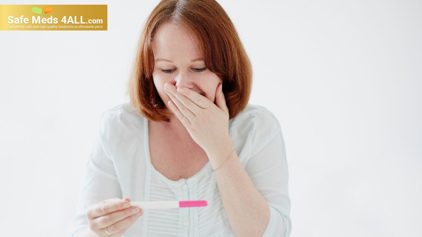A girl holding pregnancy test kit in her hands and checking the results.