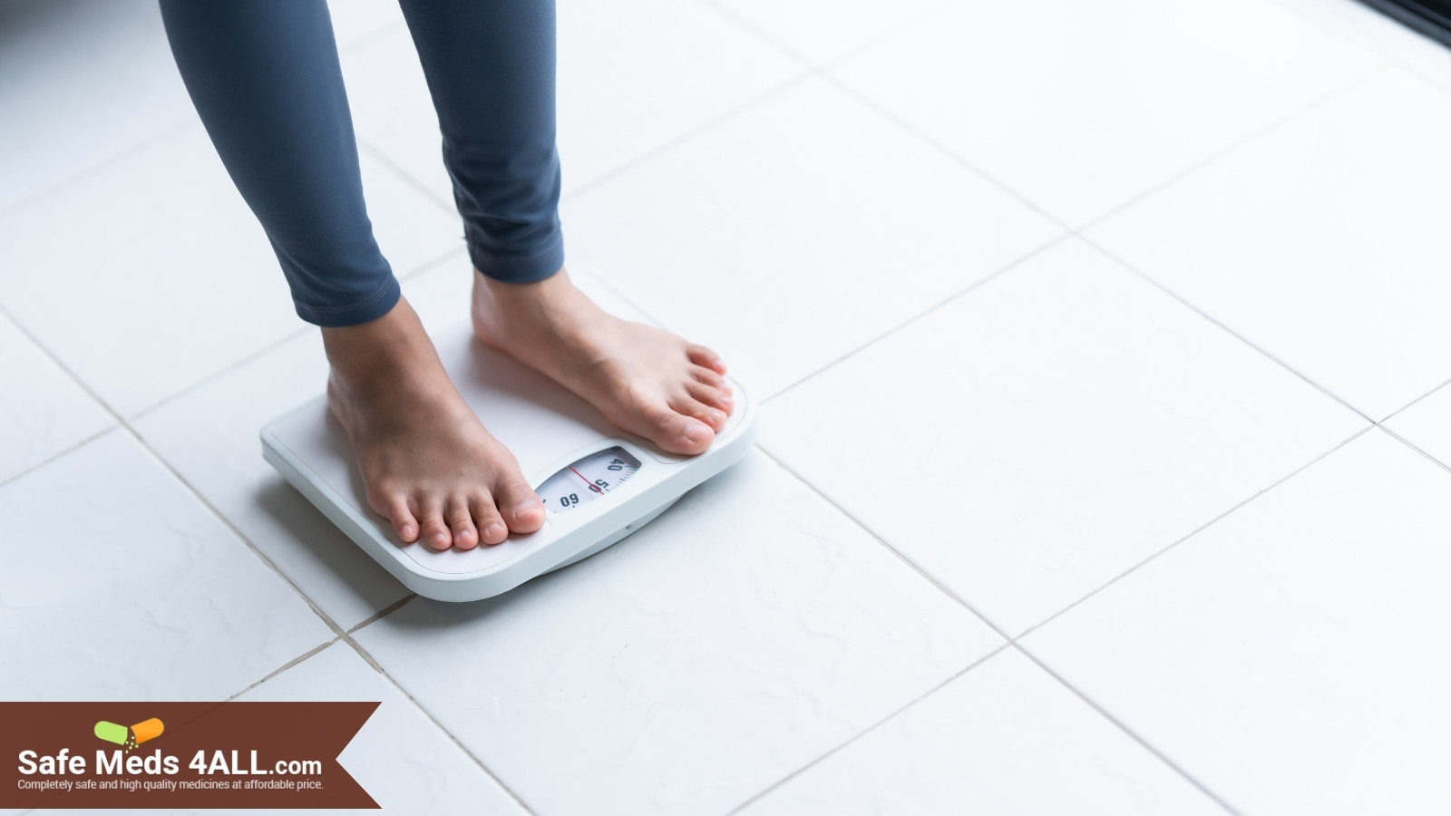 A lady standing on the weighing machine to check her weight.